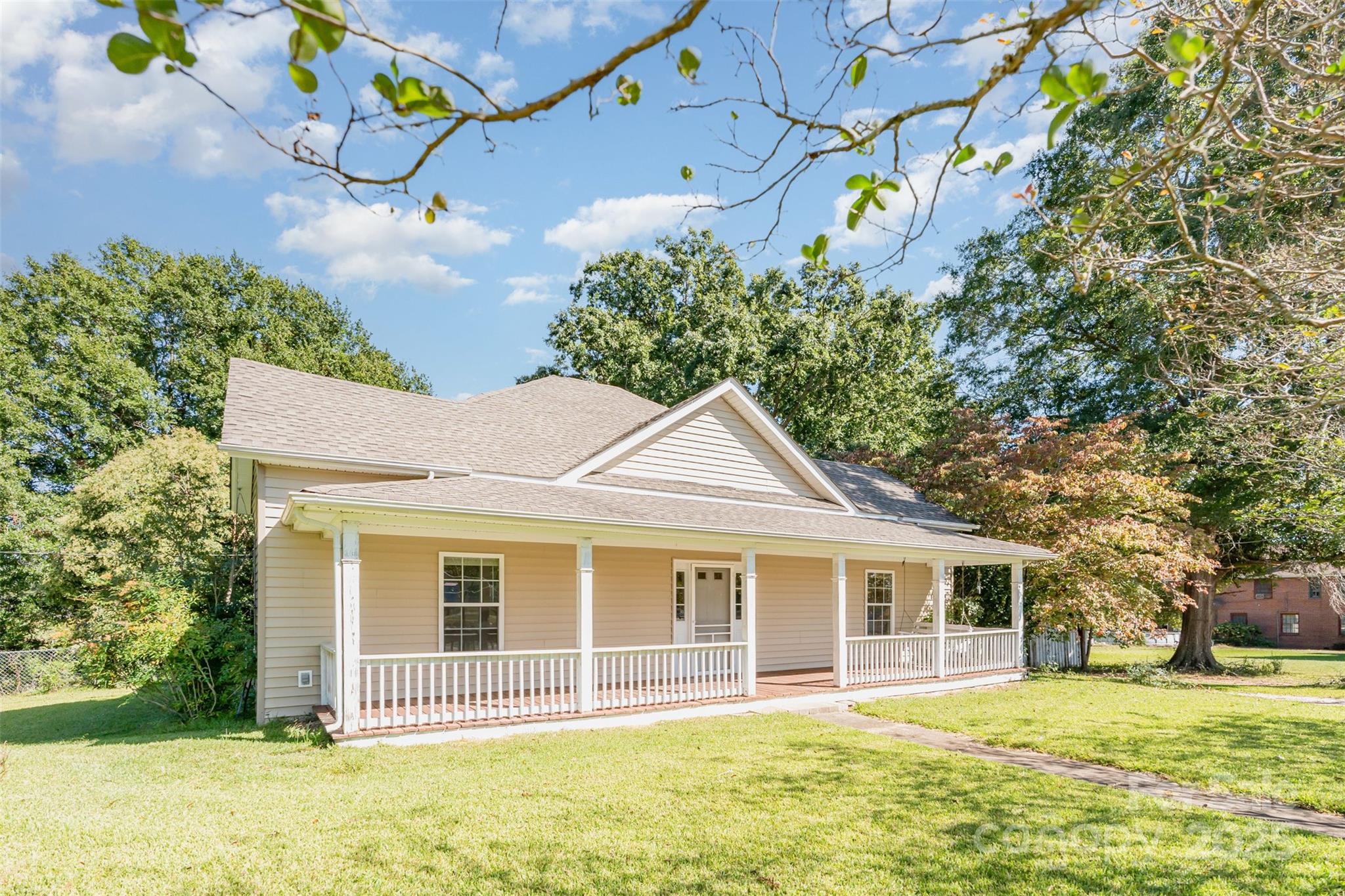 4030 Peachtree Street Hickory Grove, SC 29717 - Photo 21 of 21 a front view of a house with a garden