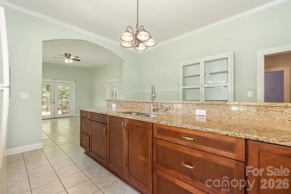 a spacious bathroom with a granite countertop sink a mirror and a