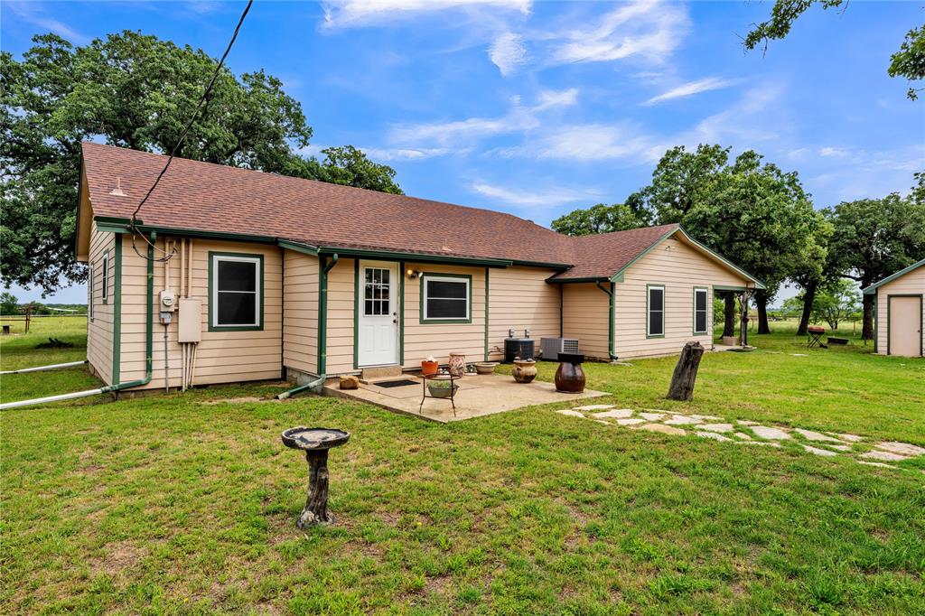 209 Dixie Road Millsap, TX 76066 - Photo 10 of 31 a house view with a sitting space and garden