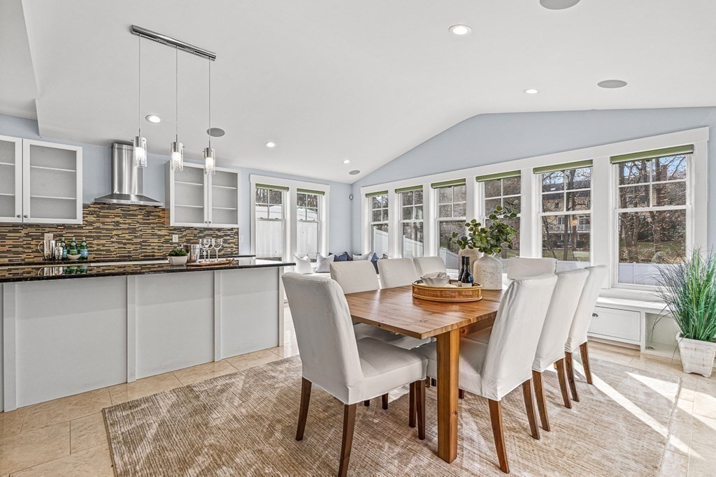 74 Oak Street Wellesley, MA 02482 - Photo 16 of 40 a dining room with furniture and large windows