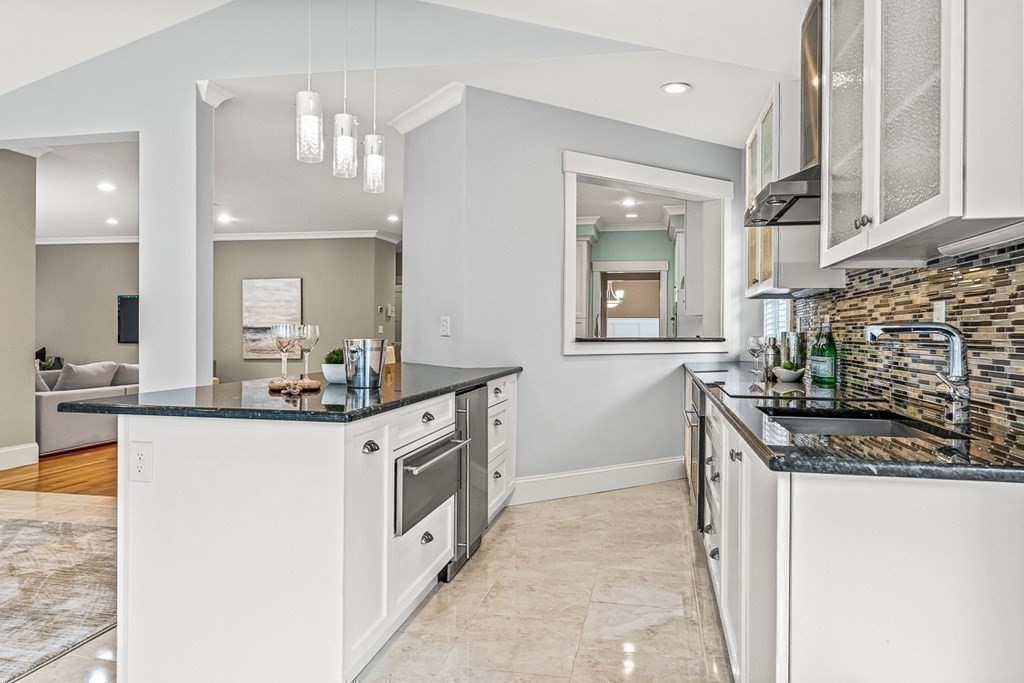 74 Oak Street Wellesley, MA 02482 - Photo 18 of 40 a kitchen with stainless steel appliances granite countertop a stove and a sink