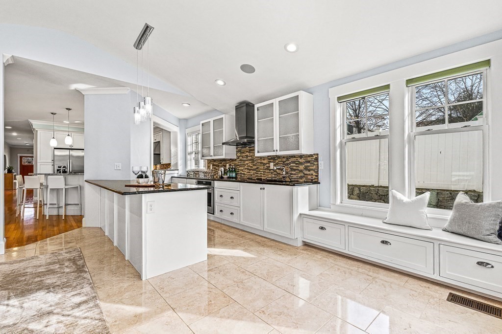 74 Oak Street Wellesley, MA 02482 - Photo 21 of 40 a large white kitchen with kitchen island and a large window