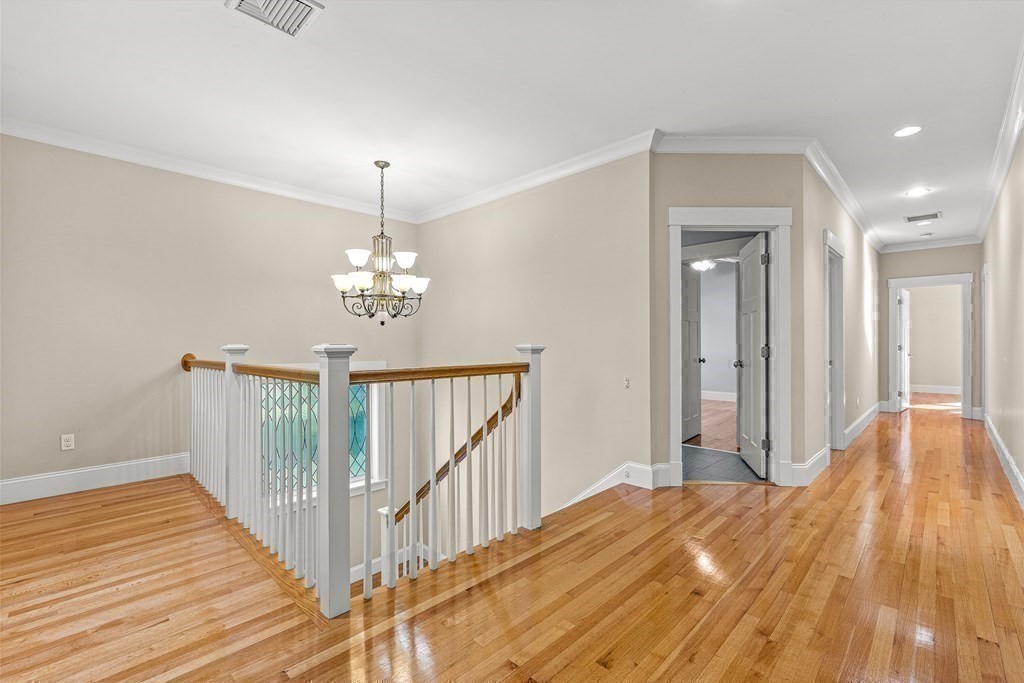 74 Oak Street Wellesley, MA 02482 - Photo 25 of 40 a view of a bedroom from a hallway
