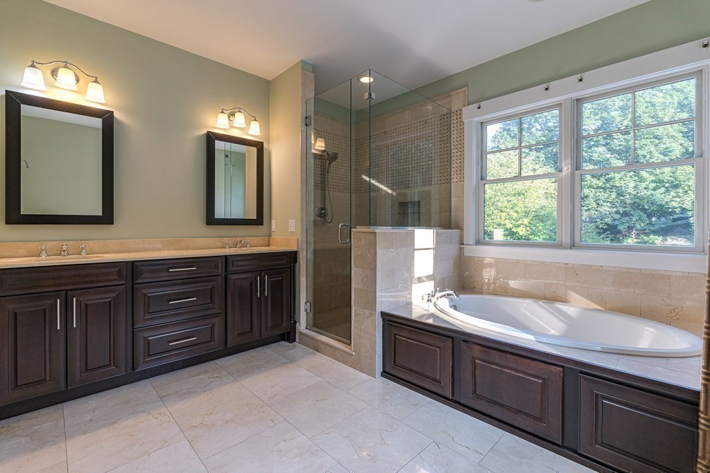74 Oak Street Wellesley, MA 02482 - Photo 27 of 40 a spacious bathroom with a granite countertop sink and a bathtub