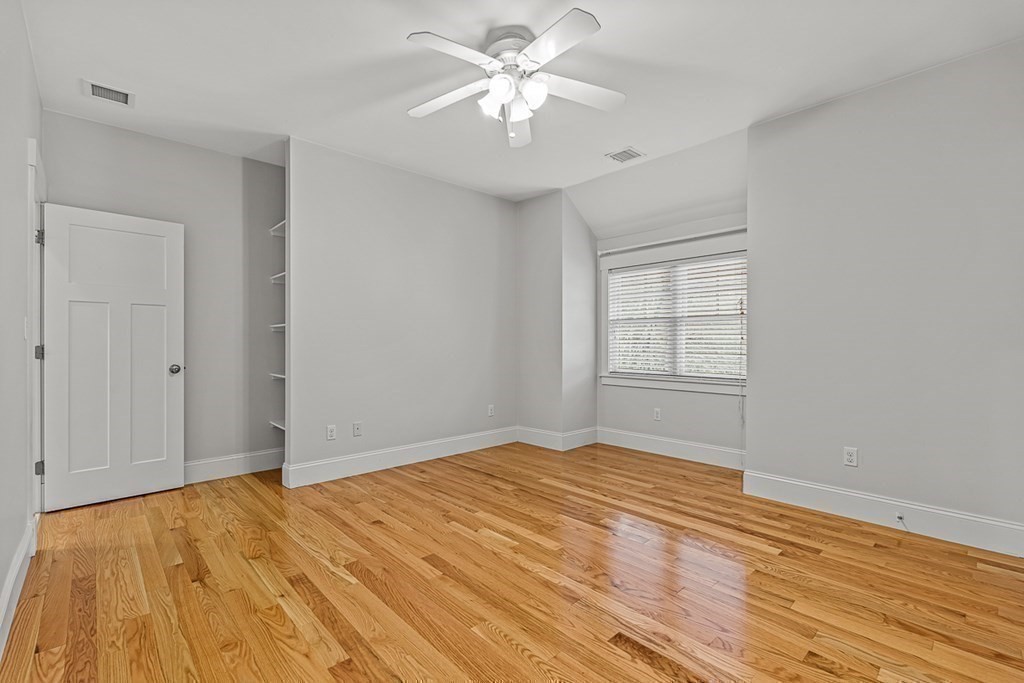 74 Oak Street Wellesley, MA 02482 - Photo 30 of 40 a view of empty room with wooden floor and fan
