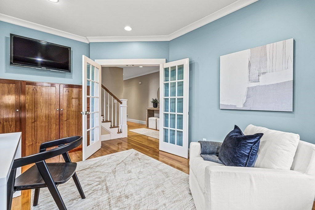 74 Oak Street Wellesley, MA 02482 - Photo 3 of 40 a living room with furniture and a flat screen tv