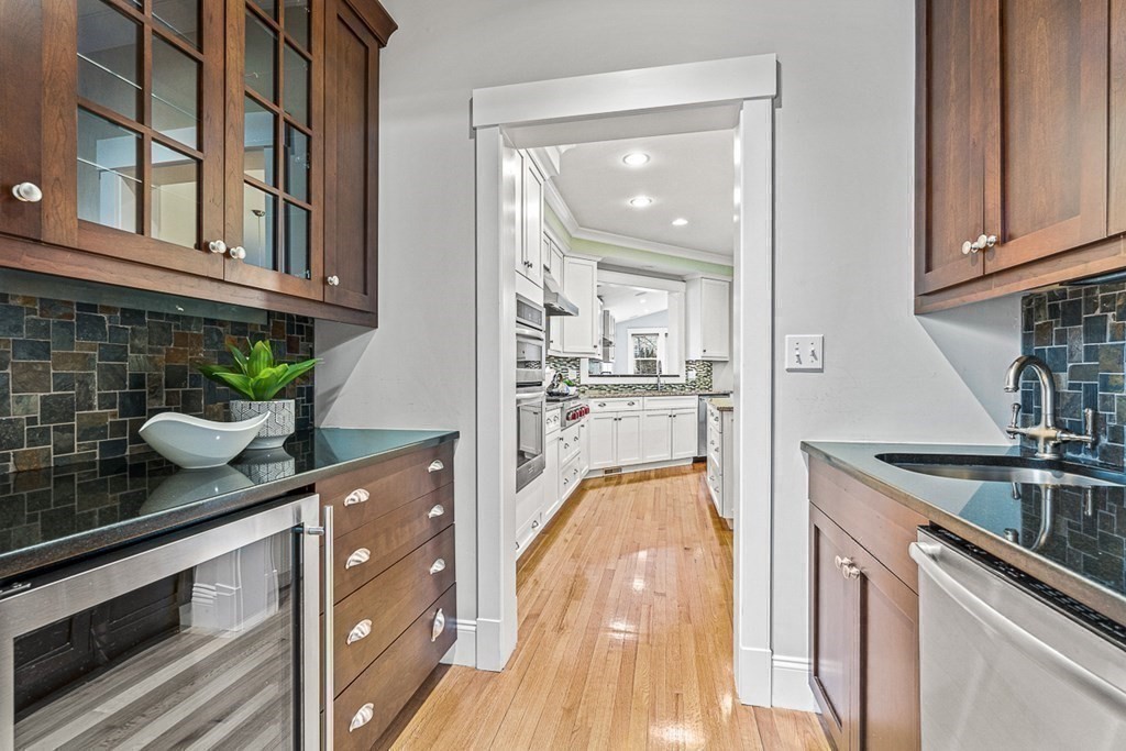 74 Oak Street Wellesley, MA 02482 - Photo 6 of 40 a kitchen with stainless steel appliances granite countertop a sink and cabinets