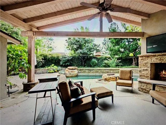 a outdoor living space with furniture and a fireplace