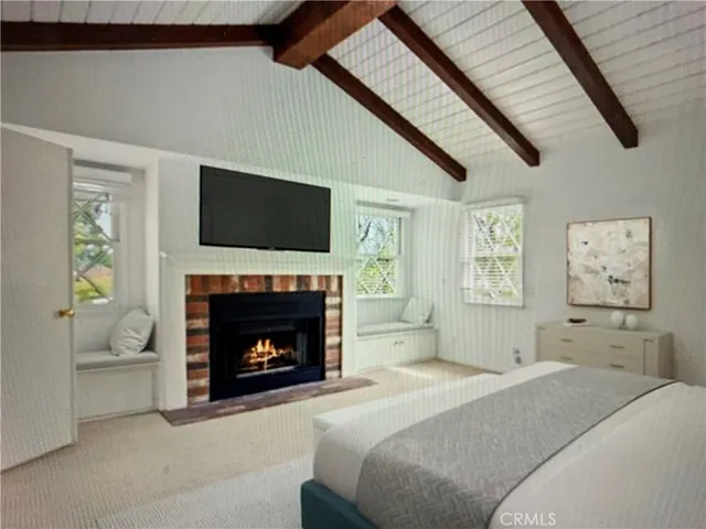 a bedroom with a bed and a fireplace