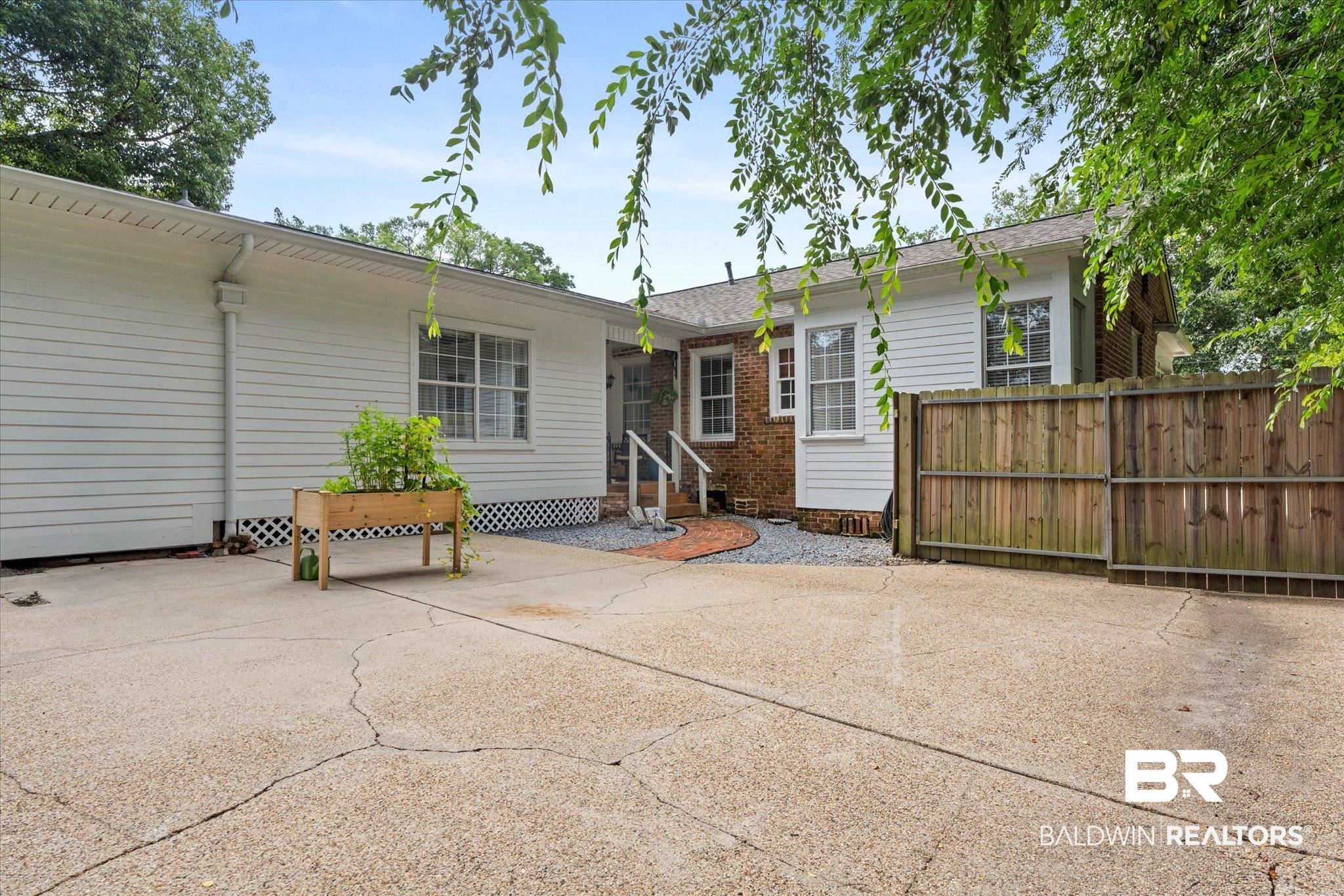 1910 Hunter Avenue Mobile, AL 36606 - Photo 18 of 21 Back of property featuring a patio, entry steps, and crawl space