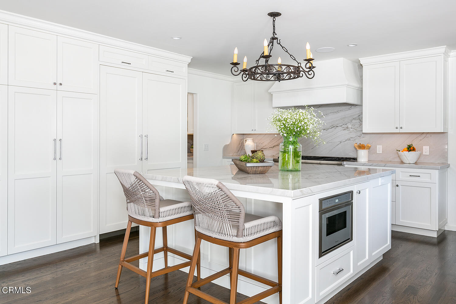 1570 San Pasqual Street Pasadena, CA 91106 - Photo 12 of 72 a kitchen with stainless steel appliances kitchen island granite countertop a dining table chairs and white cabinets