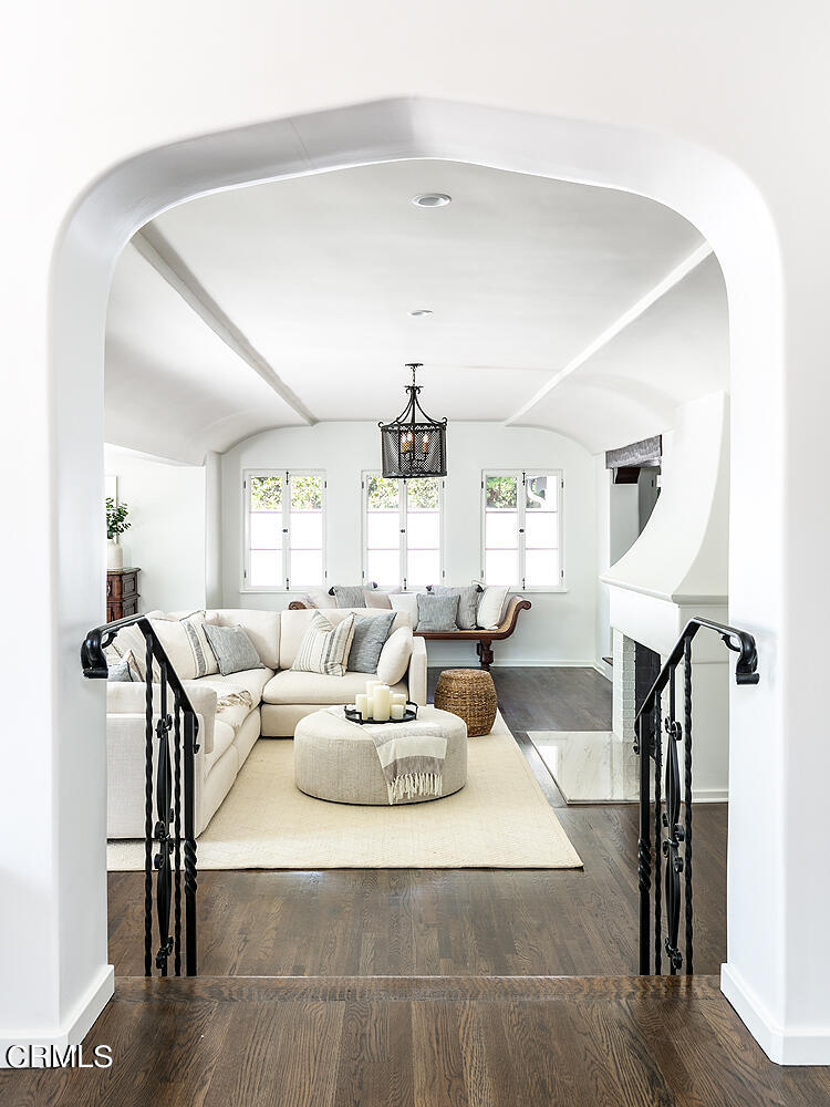 1570 San Pasqual Street Pasadena, CA 91106 - Photo 16 of 72 a living room with furniture a fireplace and a chandelier