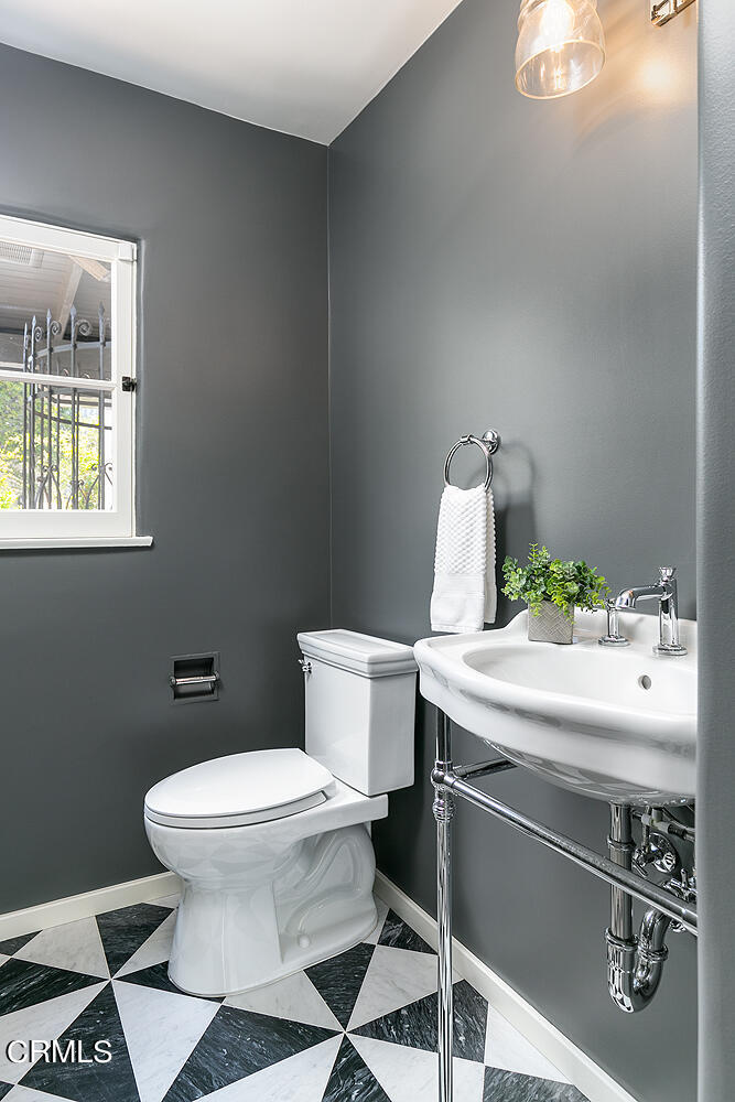 1570 San Pasqual Street Pasadena, CA 91106 - Photo 23 of 72 a bathroom with a sink a toilet and a window