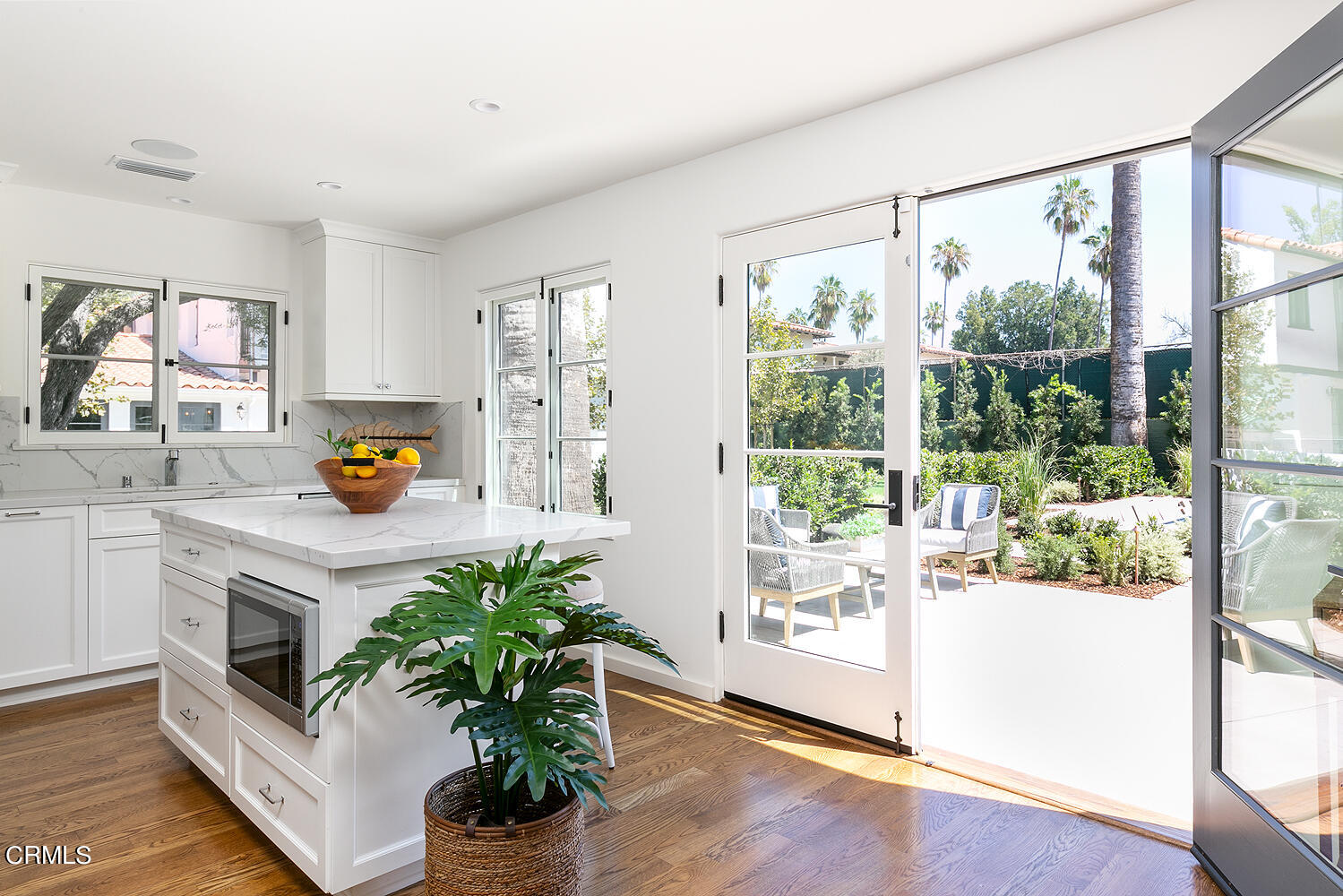 1570 San Pasqual Street Pasadena, CA 91106 - Photo 48 of 72 a white kitchen with a large window a counter top space and stainless steel appliances