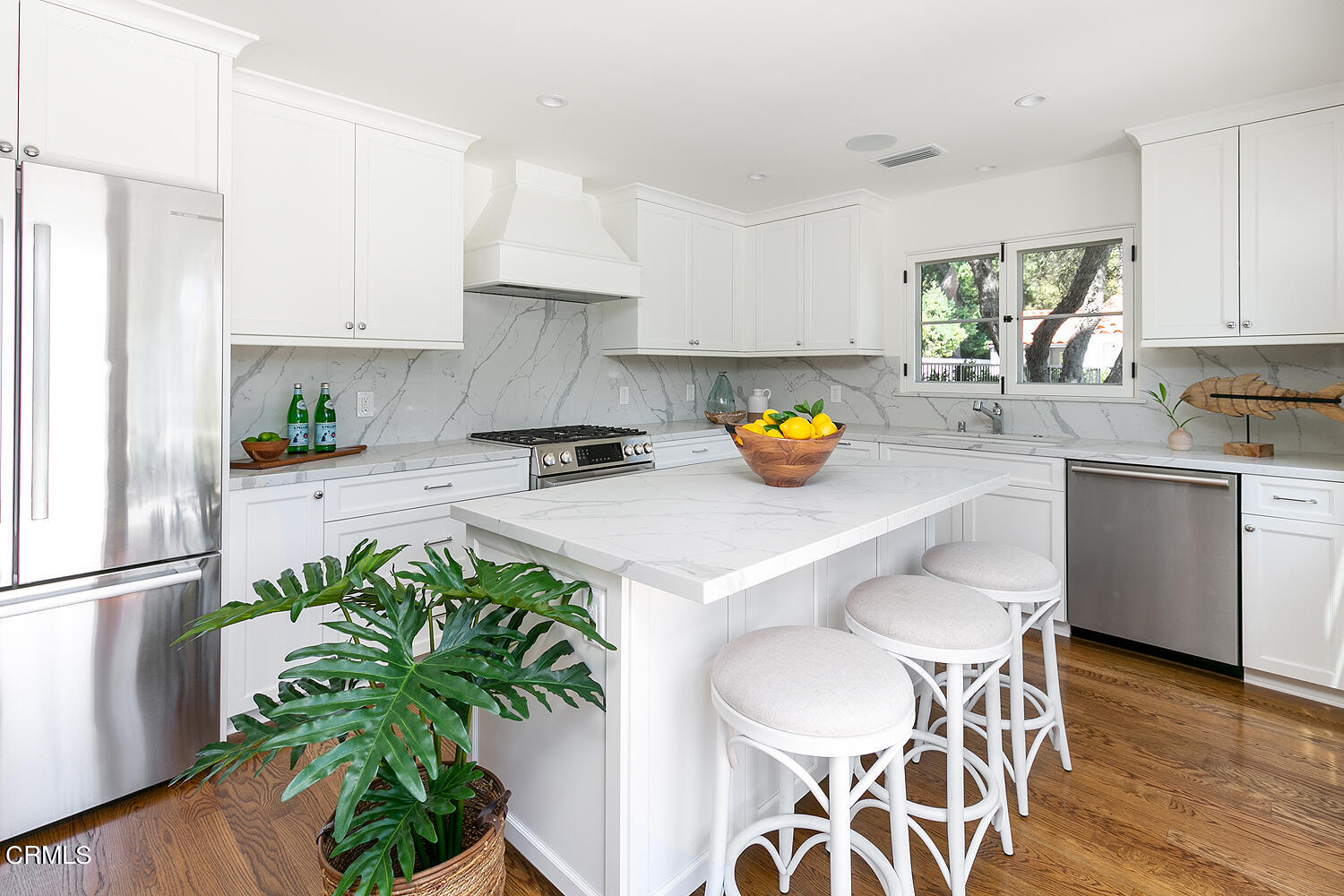 1570 San Pasqual Street Pasadena, CA 91106 - Photo 49 of 72 a kitchen with a sink white cabinets and stainless steel appliances