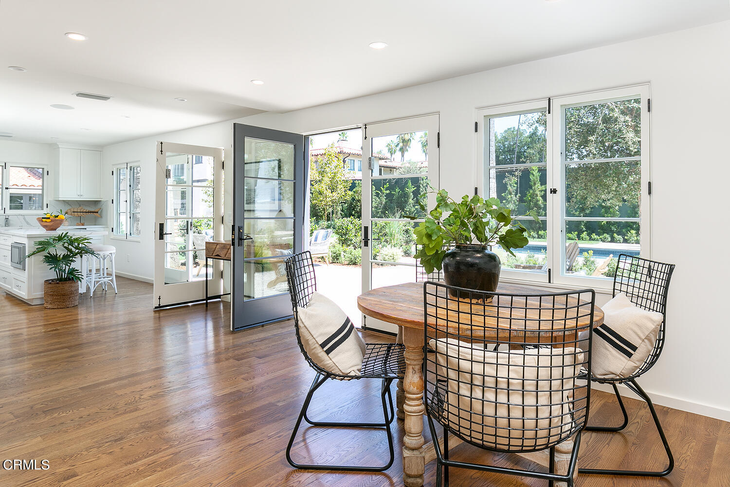 1570 San Pasqual Street Pasadena, CA 91106 - Photo 51 of 72 a dining room with furniture wooden floor and a potted plant