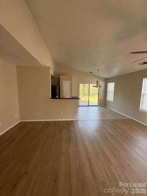 3065 Parade Lane Southwest, Unit 121 Concord, NC 28025 - Photo 2 of 12 an empty room with wooden floor and windows