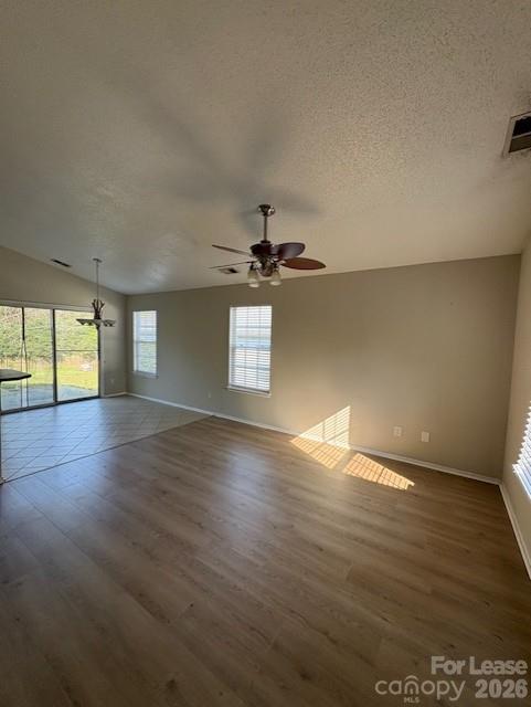 3065 Parade Lane Southwest, Unit 121 Concord, NC 28025 - Photo 3 of 12 an empty room with wooden floor and windows