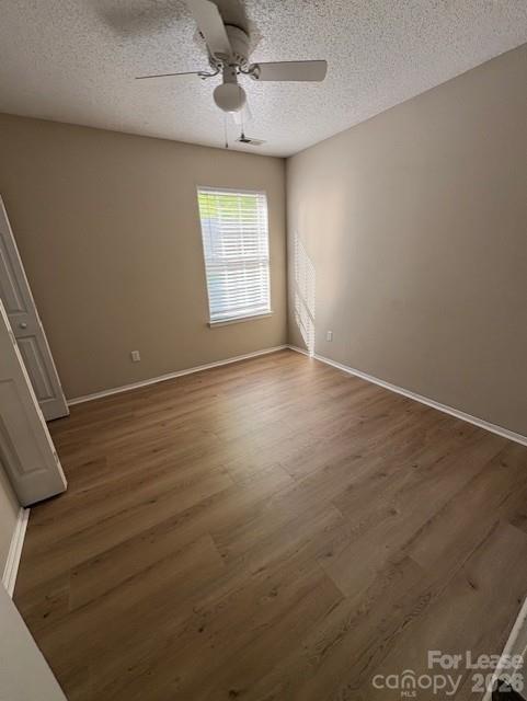 3065 Parade Lane Southwest, Unit 121 Concord, NC 28025 - Photo 7 of 12 an empty room with windows and fan