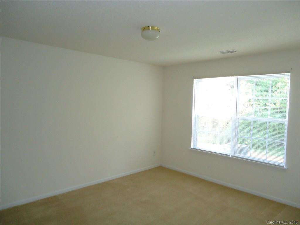 16824 Timber Crossing Road Charlotte, NC 28213 - Photo 11 of 23 an empty room with a window
