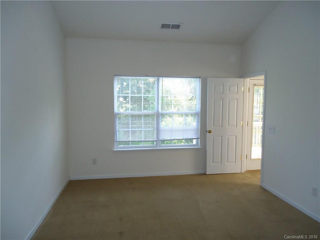 16824 Timber Crossing Road Charlotte, NC 28213 - Photo 12 of 23 an empty room with a window