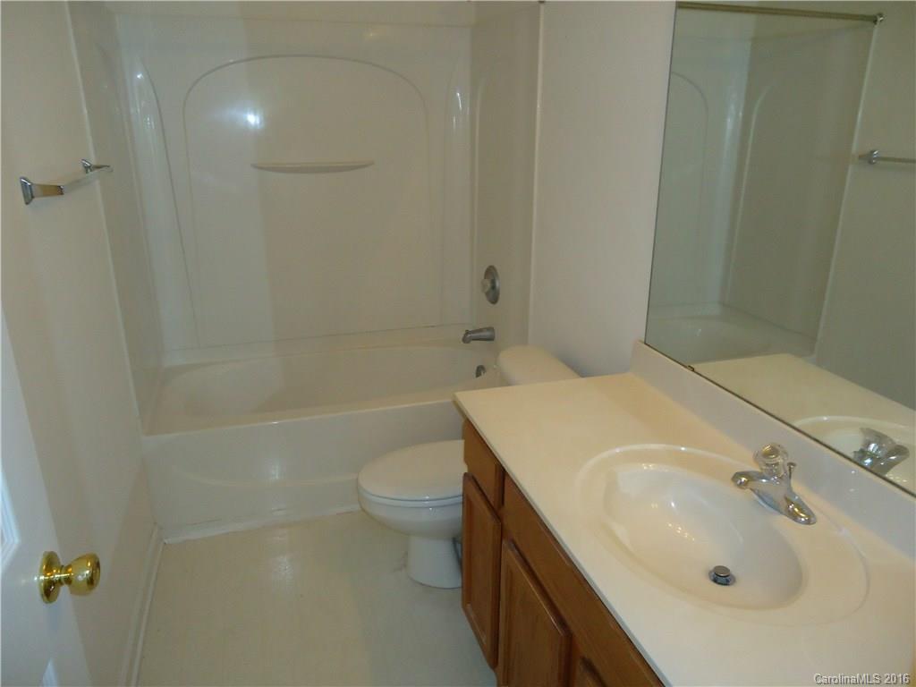 16824 Timber Crossing Road Charlotte, NC 28213 - Photo 14 of 23 a bathroom with a sink toilet and shower