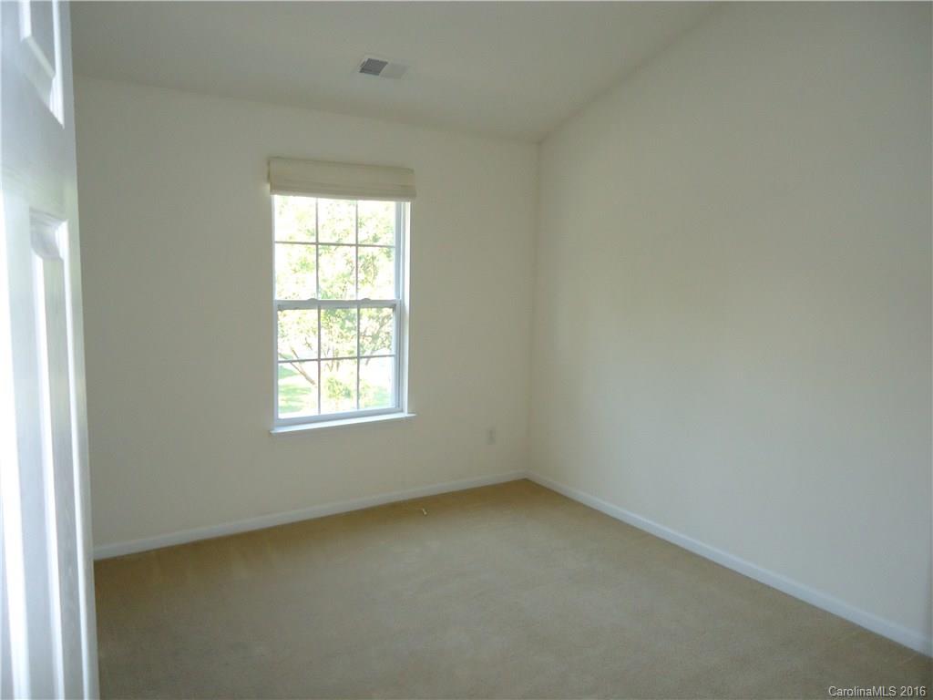 16824 Timber Crossing Road Charlotte, NC 28213 - Photo 15 of 23 an empty room with a window