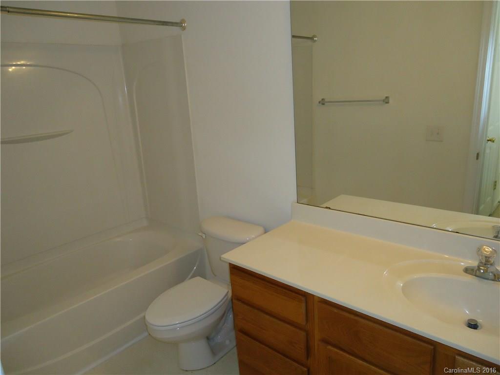 16824 Timber Crossing Road Charlotte, NC 28213 - Photo 18 of 23 a bathroom with a sink a toilet and shower