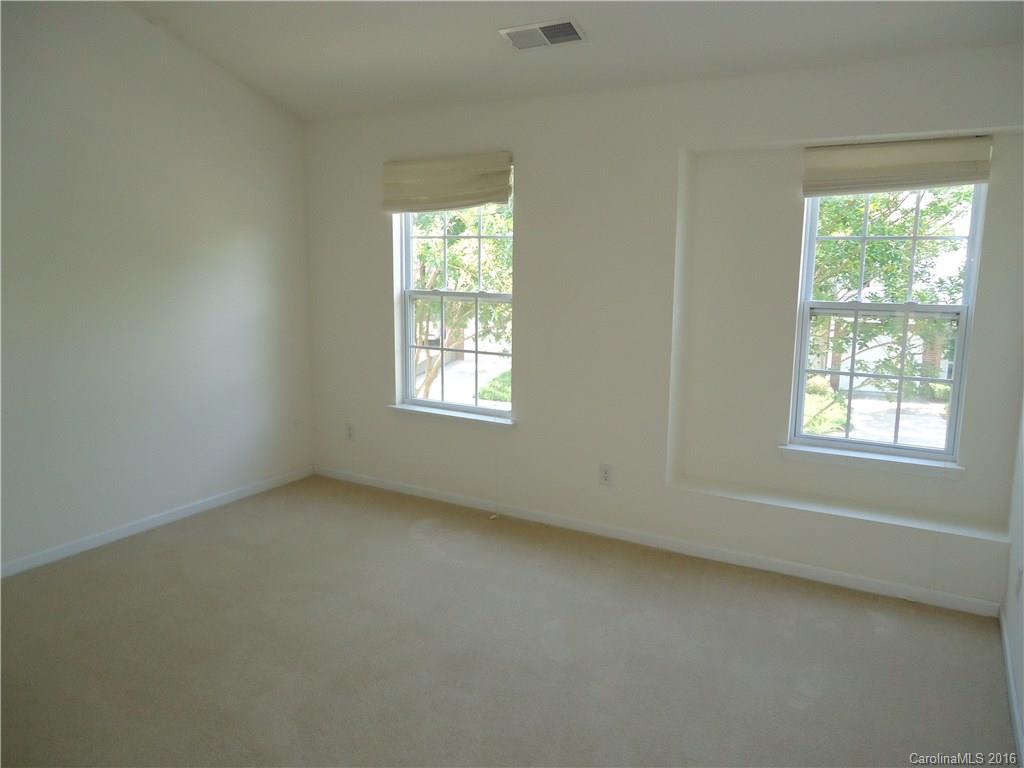 16824 Timber Crossing Road Charlotte, NC 28213 - Photo 10 of 23 an empty room with a window