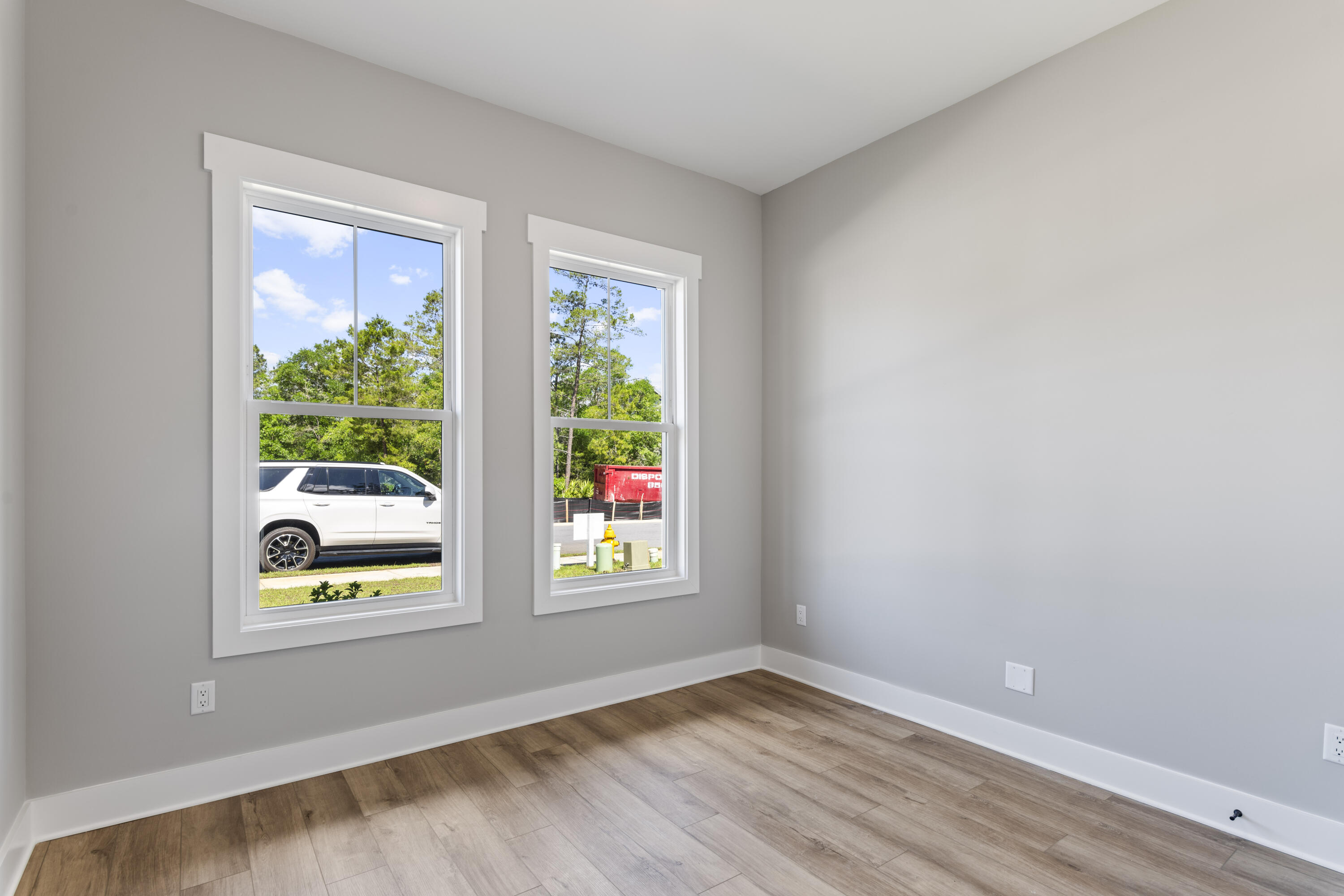 162 Channel Shoal Drive, Unit LOT 2 Santa Rosa Beach, FL 32459 - Photo 17 of 36 a view of an empty room with wooden floor and windows