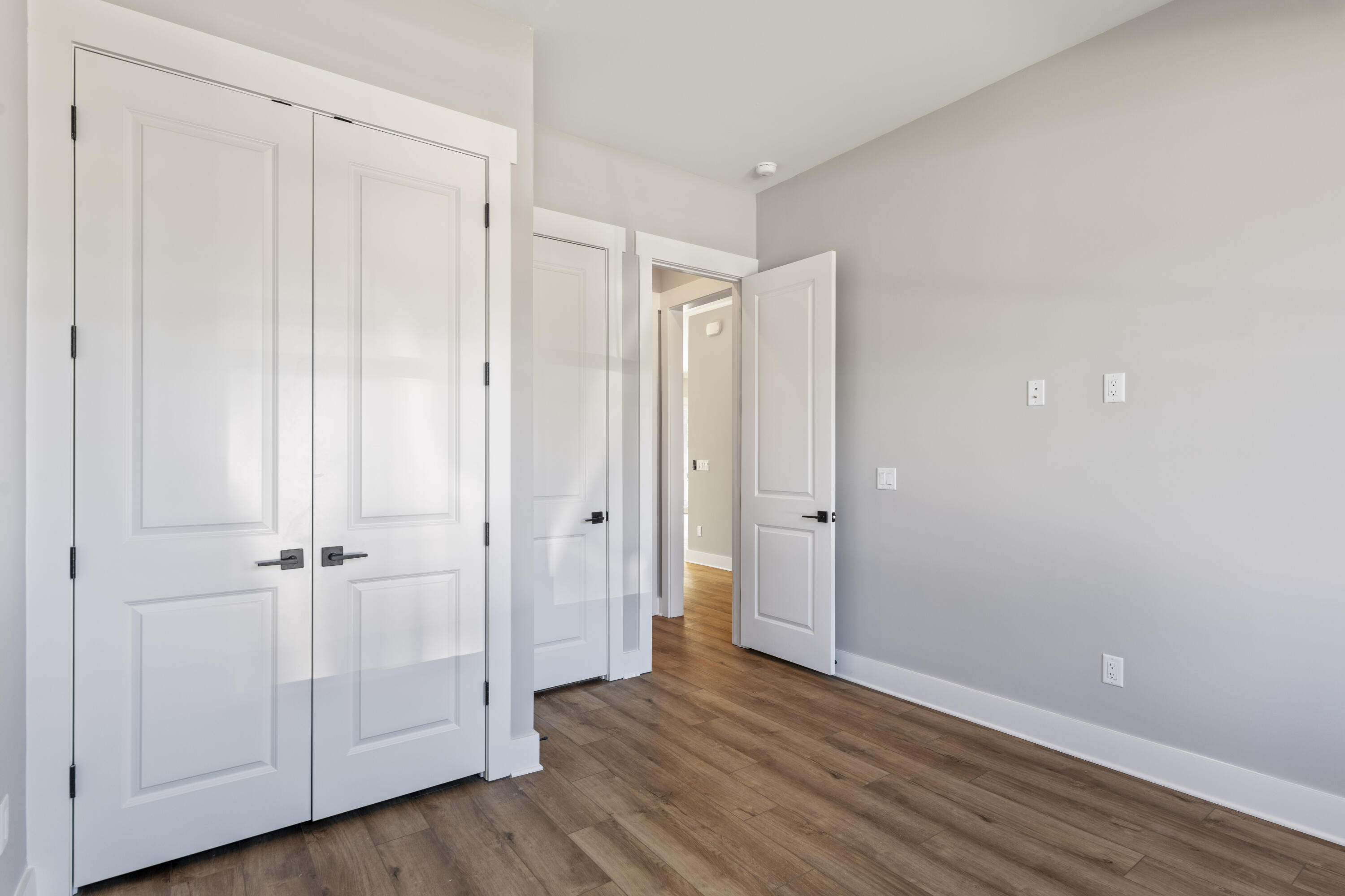 162 Channel Shoal Drive, Unit LOT 2 Santa Rosa Beach, FL 32459 - Photo 18 of 36 a view of an empty room with wooden floor