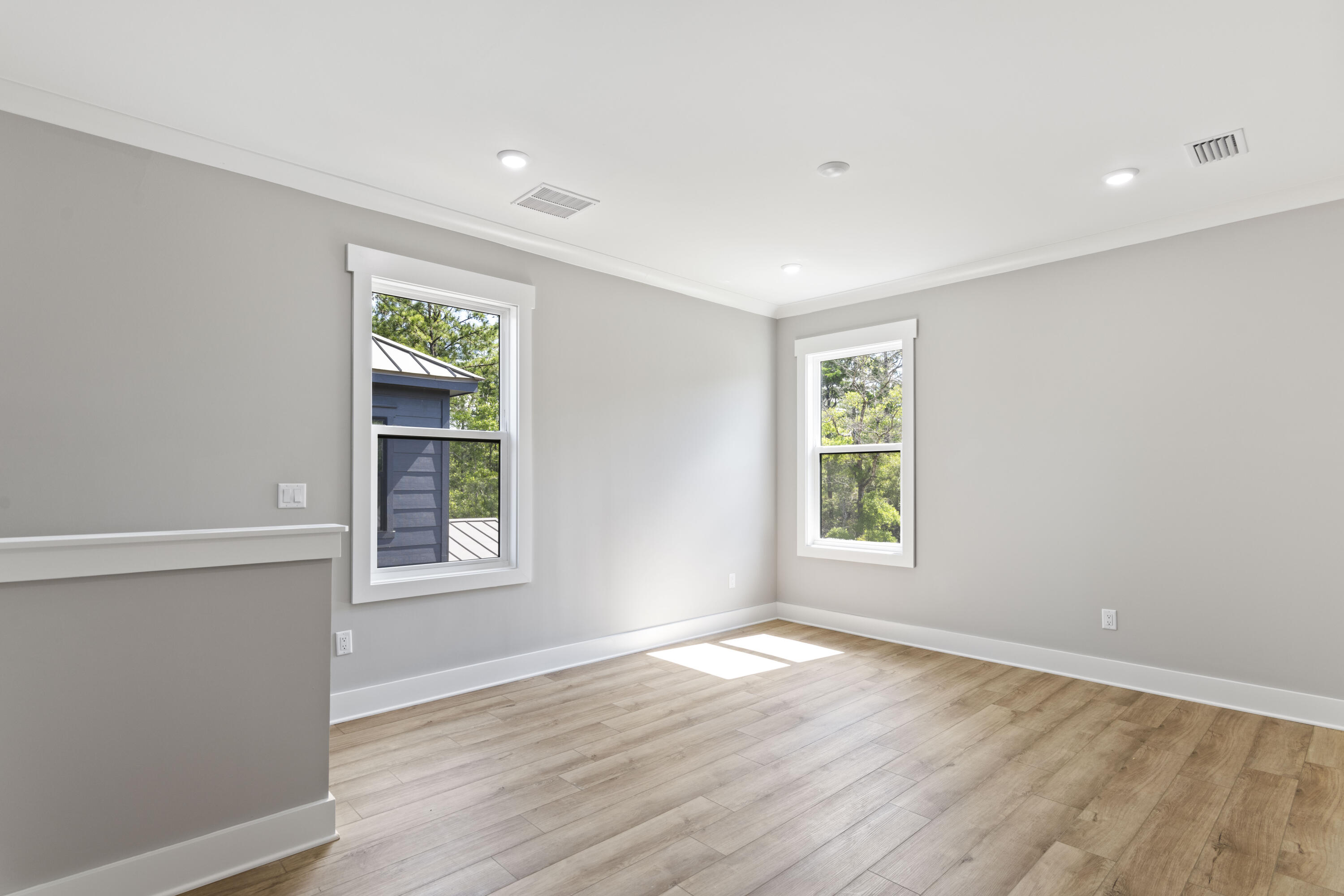 162 Channel Shoal Drive, Unit LOT 2 Santa Rosa Beach, FL 32459 - Photo 20 of 36 an empty room with wooden floor and windows