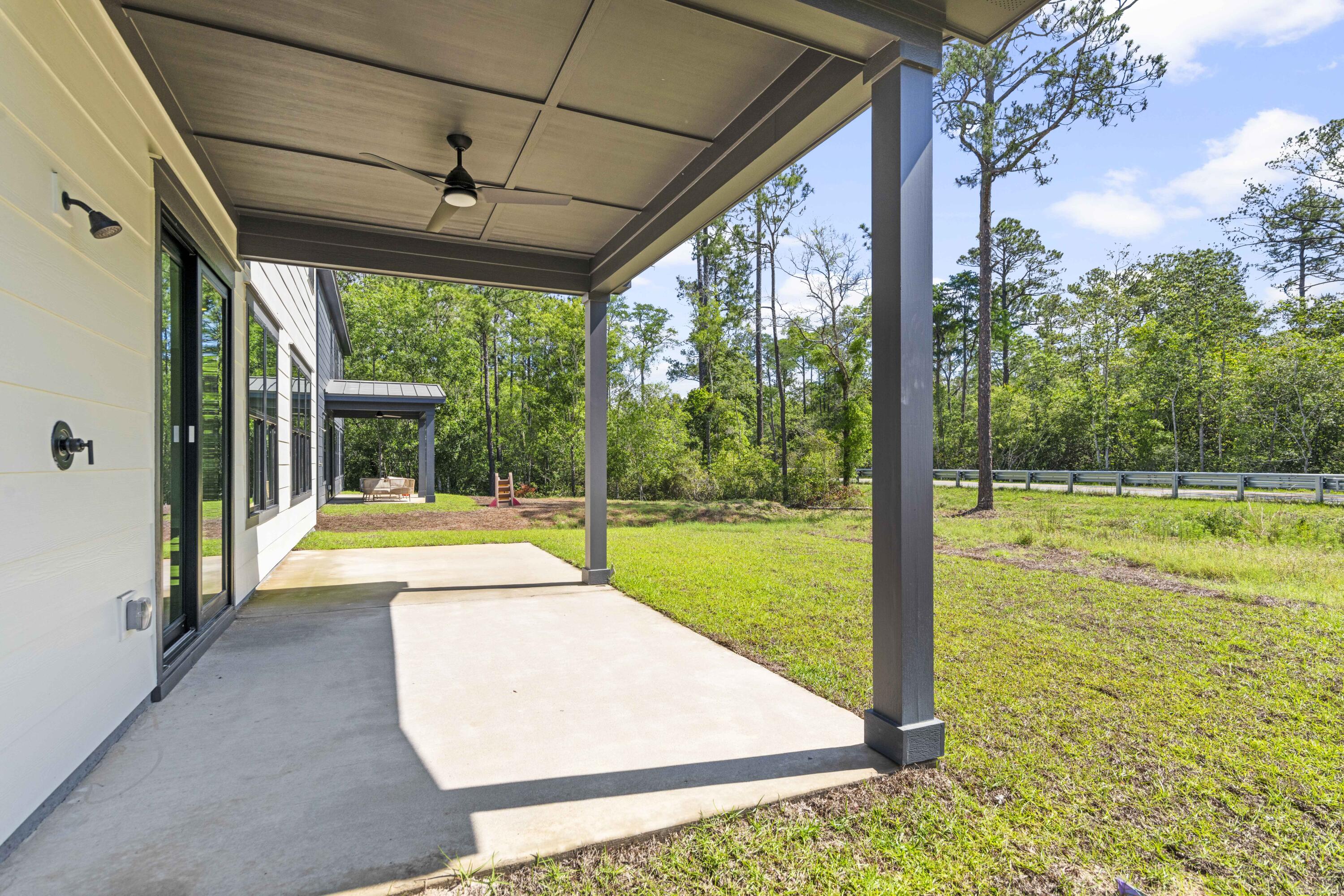 162 Channel Shoal Drive, Unit LOT 2 Santa Rosa Beach, FL 32459 - Photo 32 of 36 a view of a swimming pool with a large garden