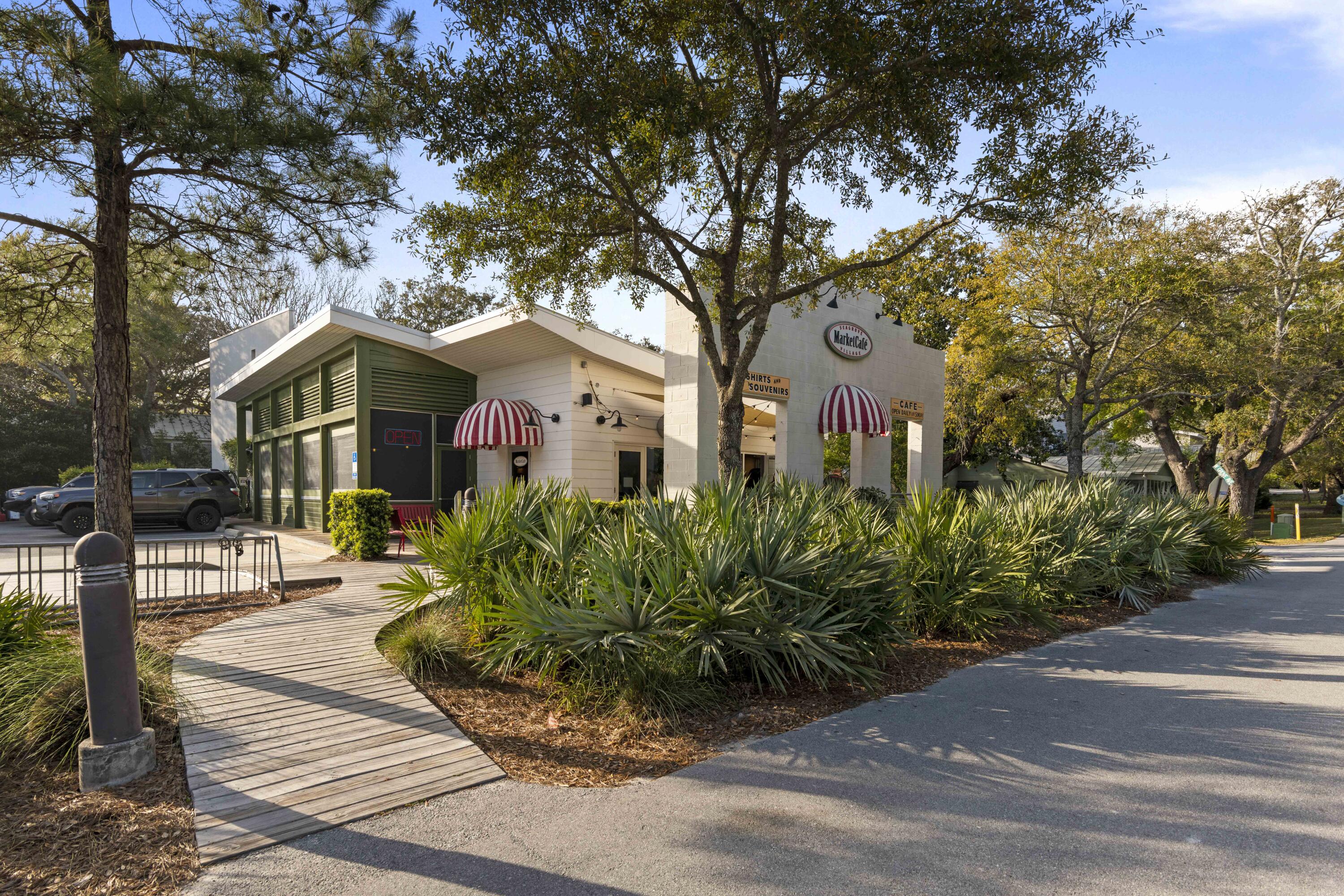 162 Channel Shoal Drive, Unit LOT 2 Santa Rosa Beach, FL 32459 - Photo 38 of 40 a front view of a house with a garden