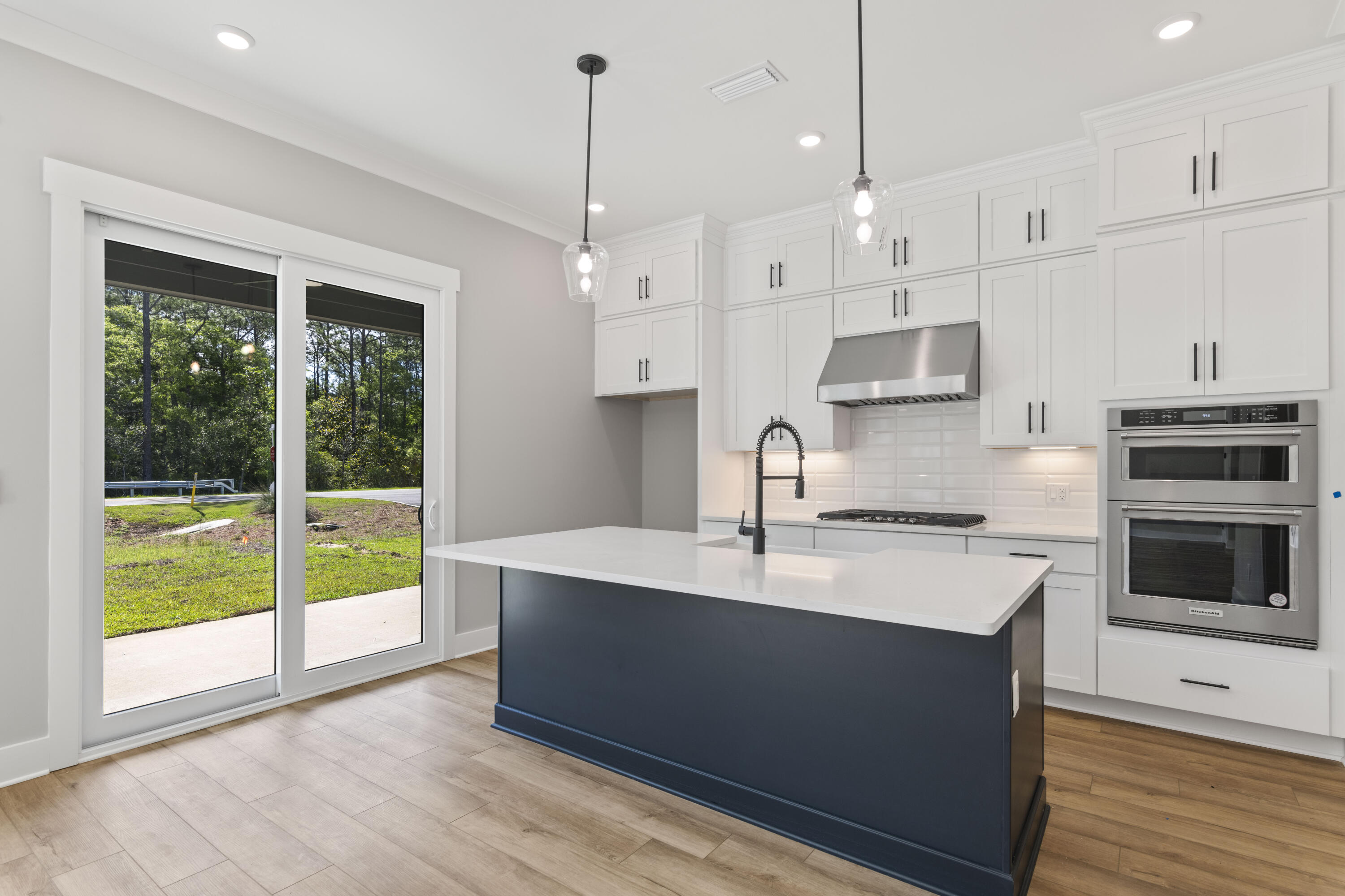 162 Channel Shoal Drive, Unit LOT 2 Santa Rosa Beach, FL 32459 - Photo 7 of 36 a kitchen with granite countertop a sink a counter space appliances and cabinets