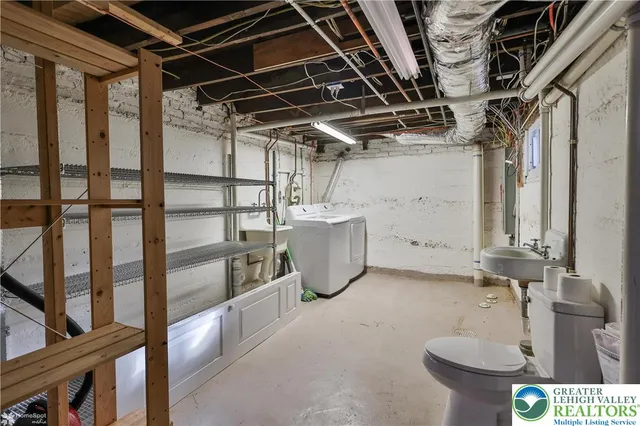 a bathroom with a sink and toilet