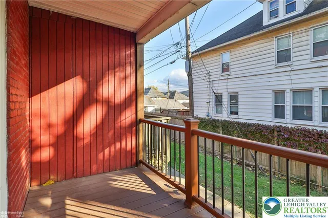 a view of a balcony with a pot