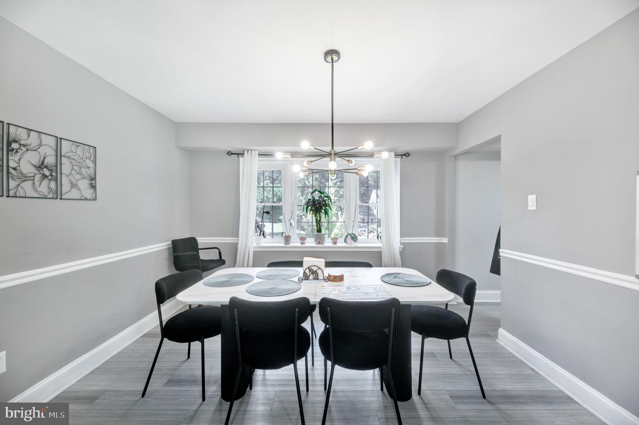 8812 Churchfield Lane Laurel, MD 20708 - Photo 15 of 31 a view of a dining room with furniture window and outside view