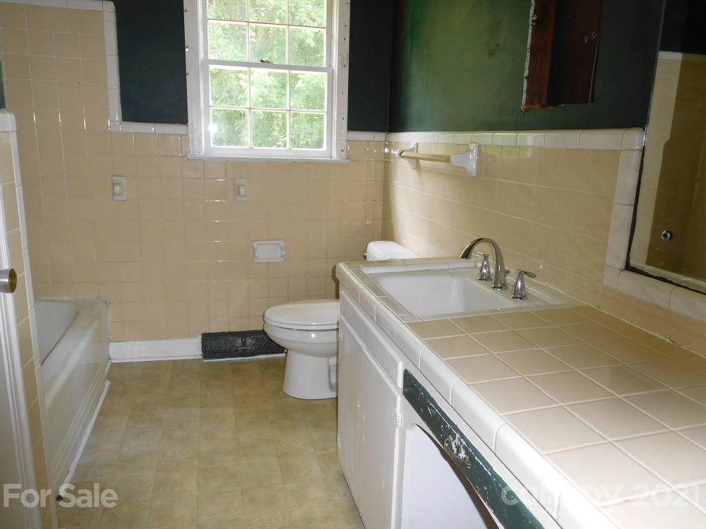 621 Charles Road Shelby, NC 28152 - Photo 11 of 17 a bathroom with a sink and a toilet