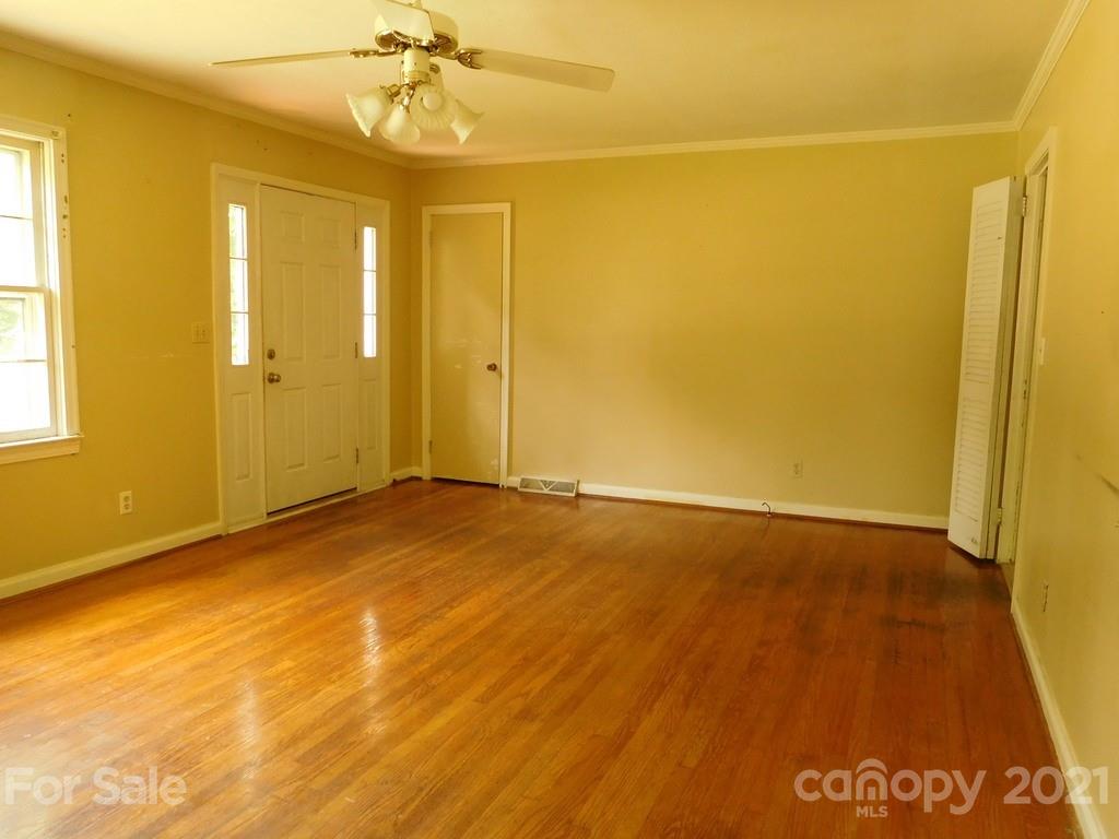 621 Charles Road Shelby, NC 28152 - Photo 3 of 17 a view of an empty room with a window