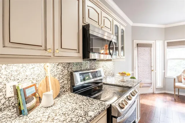 a kitchen with a stove a sink and a refrigerator