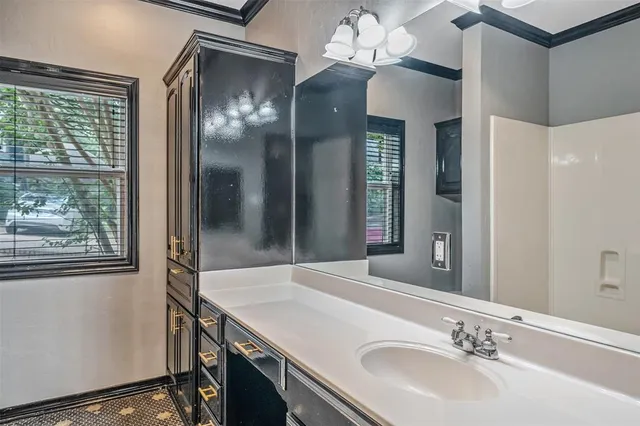 a room with cabinet and window