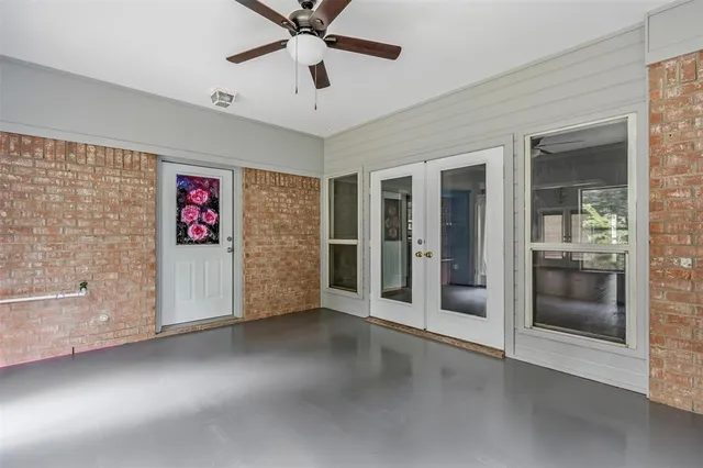 a front view of a house with yard and green space