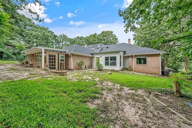 a house with trees in the background