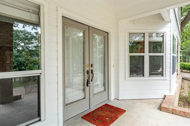 a living room with fireplace furniture and a chandelier