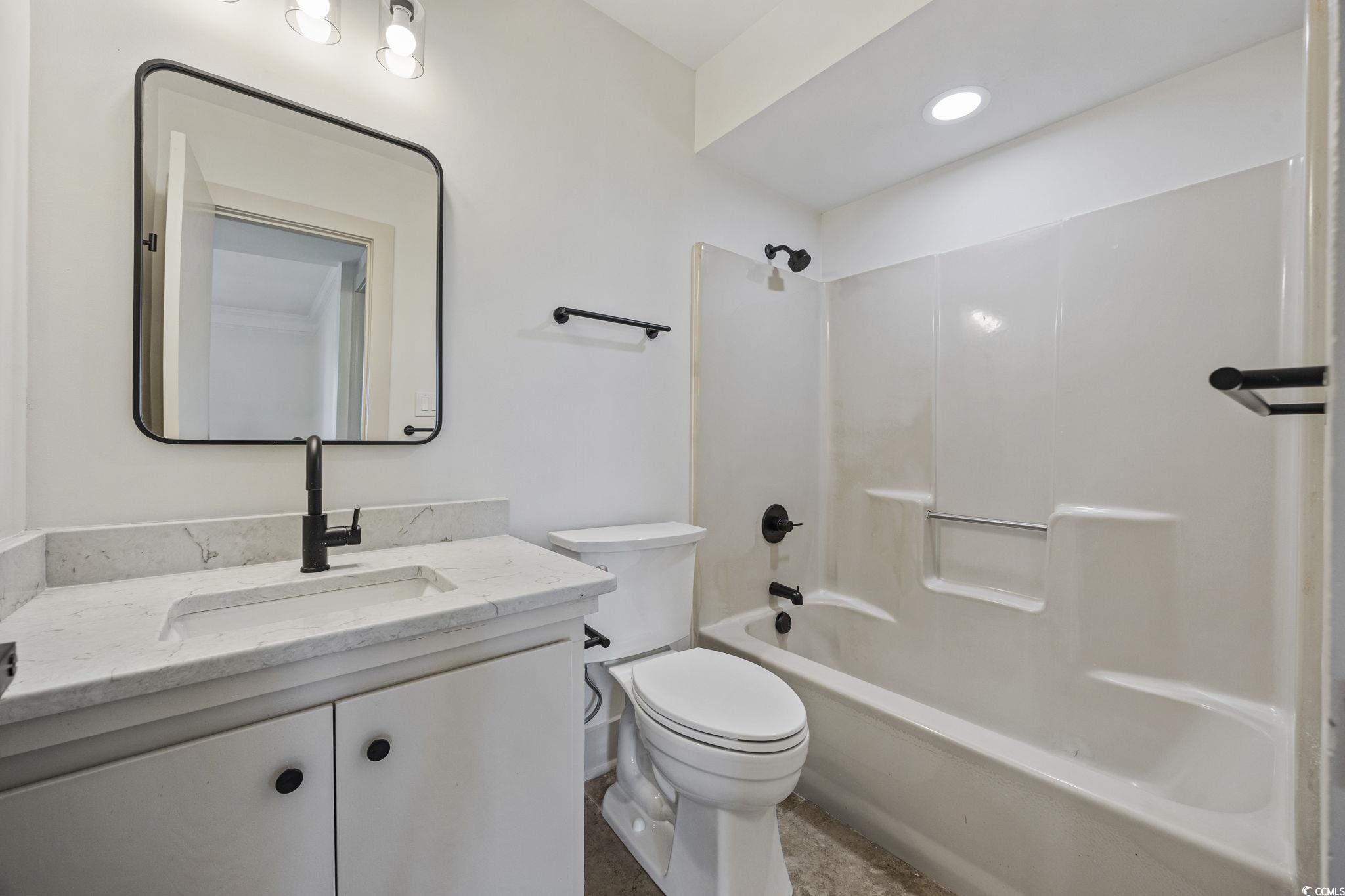 513 Plantation Drive Surfside Beach, SC 29575 - Photo 22 of 44 Guest and secondary bathroom featuring a modern vanity, a clean tub and shower combination, and recessed lighting for a bright, polished finish.