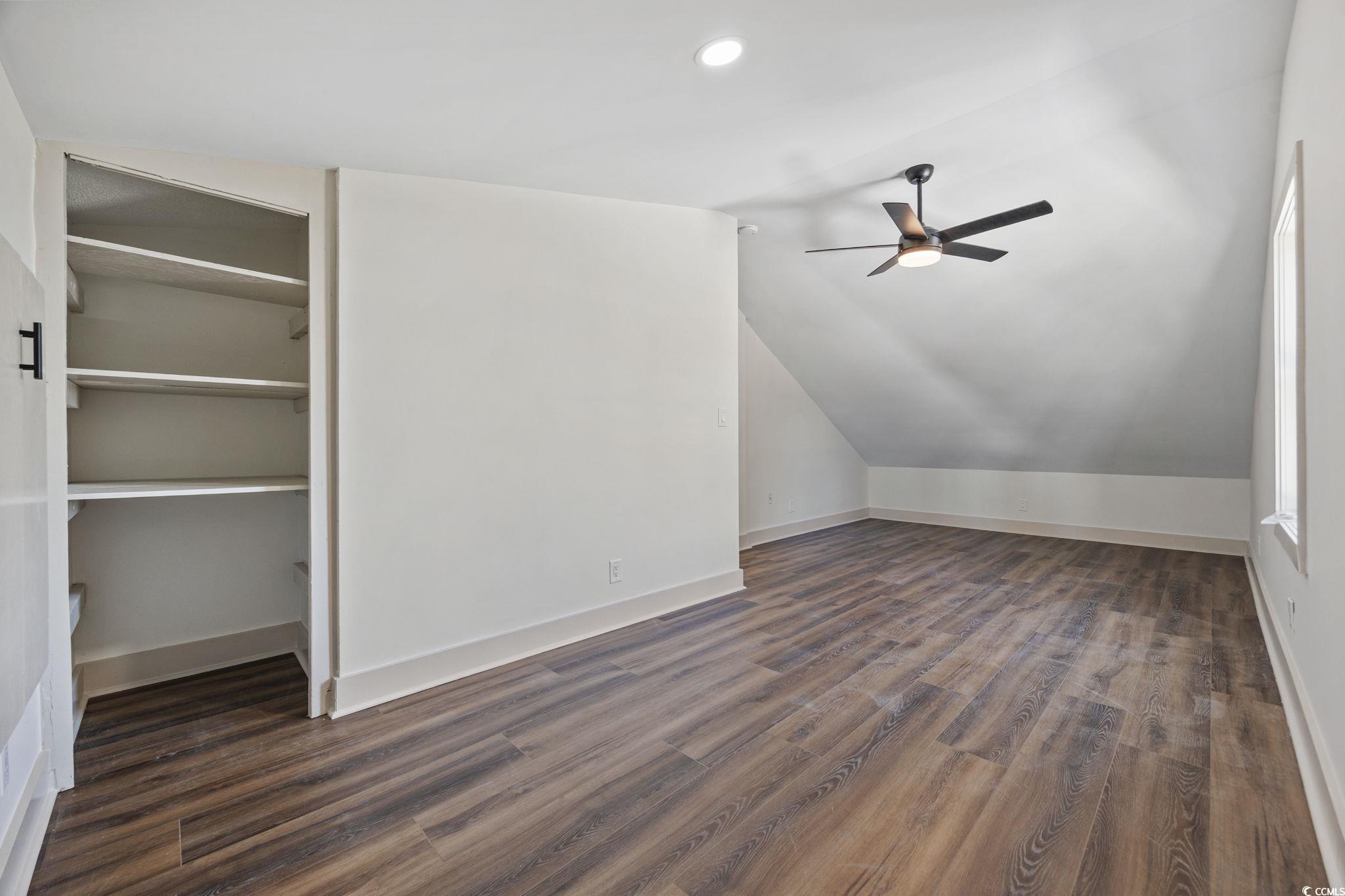513 Plantation Drive Surfside Beach, SC 29575 - Photo 31 of 44 Additional living space with dark wood finished floors, lofted ceiling, a ceiling fan, and recessed lighting