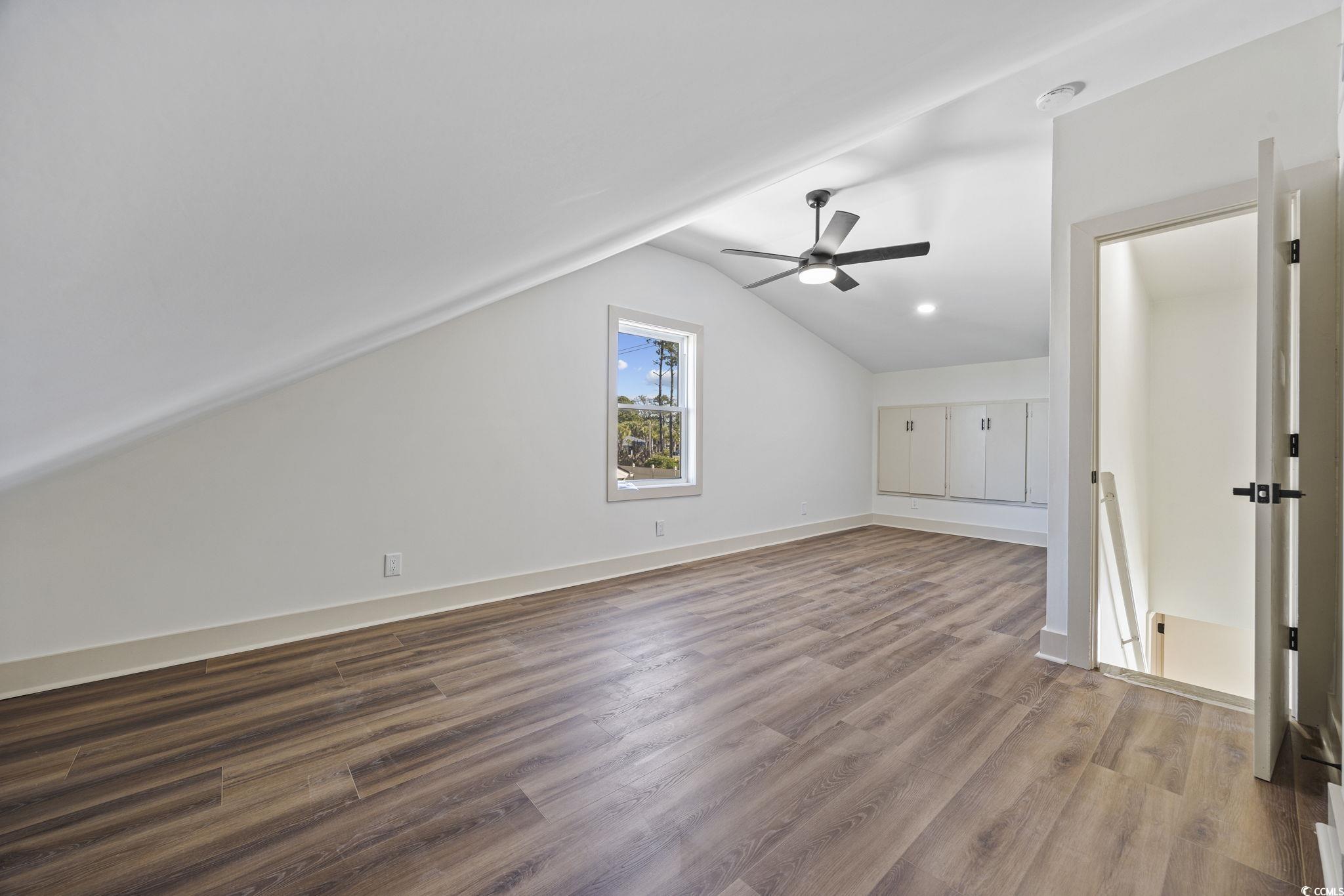 513 Plantation Drive Surfside Beach, SC 29575 - Photo 32 of 44 Bonus room with lofted ceiling, light wood-style floors, and ceiling fan
