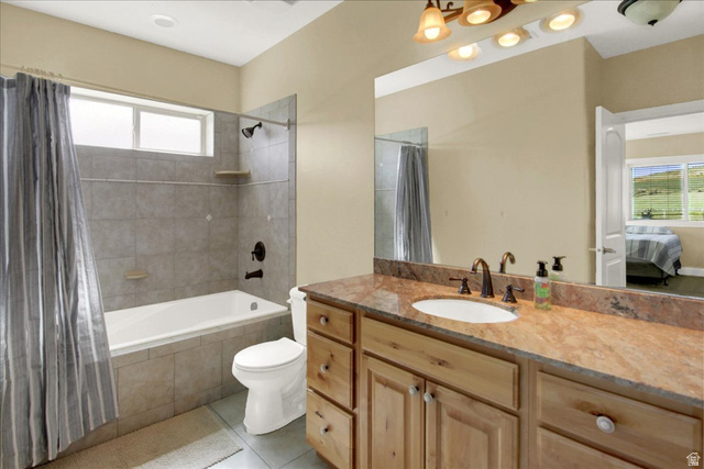 667 Hardscrabble Road Morgan, UT 84050 - Photo 39 of 51 North Basement Bedroom Ensuite bathroom with tiled shower / bath combo, vanity, and light tile patterned floors