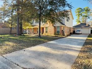 5330 Nodaway Lane Spring, TX 77379 - Photo 2 of 14 a front view of a house with a yard